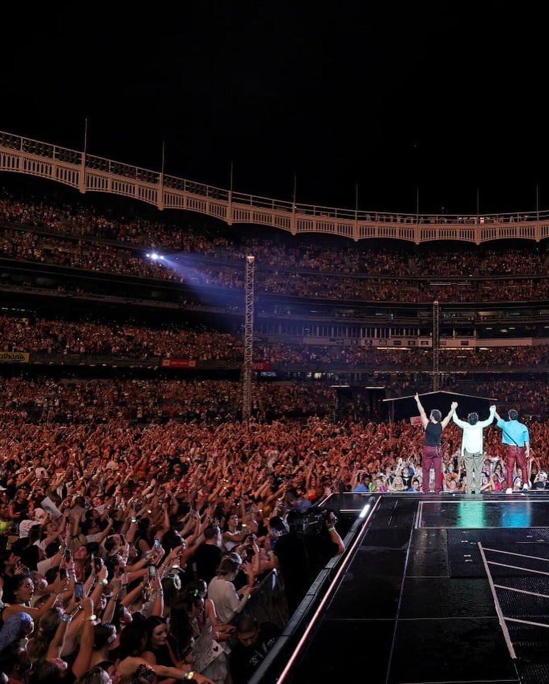 Priyanka And Nick Jonas Get Ready For The Jonas Brothers' Tour At Yankee Stadium: Nick and brothers enjoying the audience's adoration at the packed house at Yankee Stadium. Photo Credit: www.instagram.com